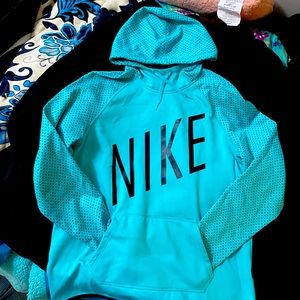 Nike Dri-Fit Sweater in the shade of Blue Aqua in Woman’s Large.